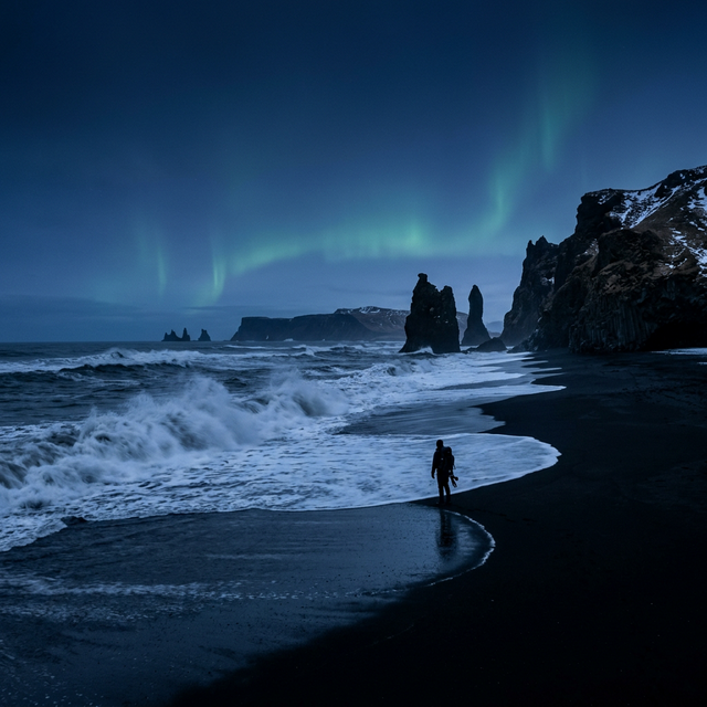 Iceland black sand beach with Northern Lights